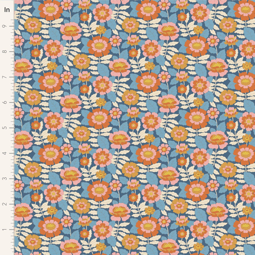 A closeup of the quilting fabric pattern called Beverly, designed by Tone Finnanger, in the blue colorway. The SKU is TIL100611.