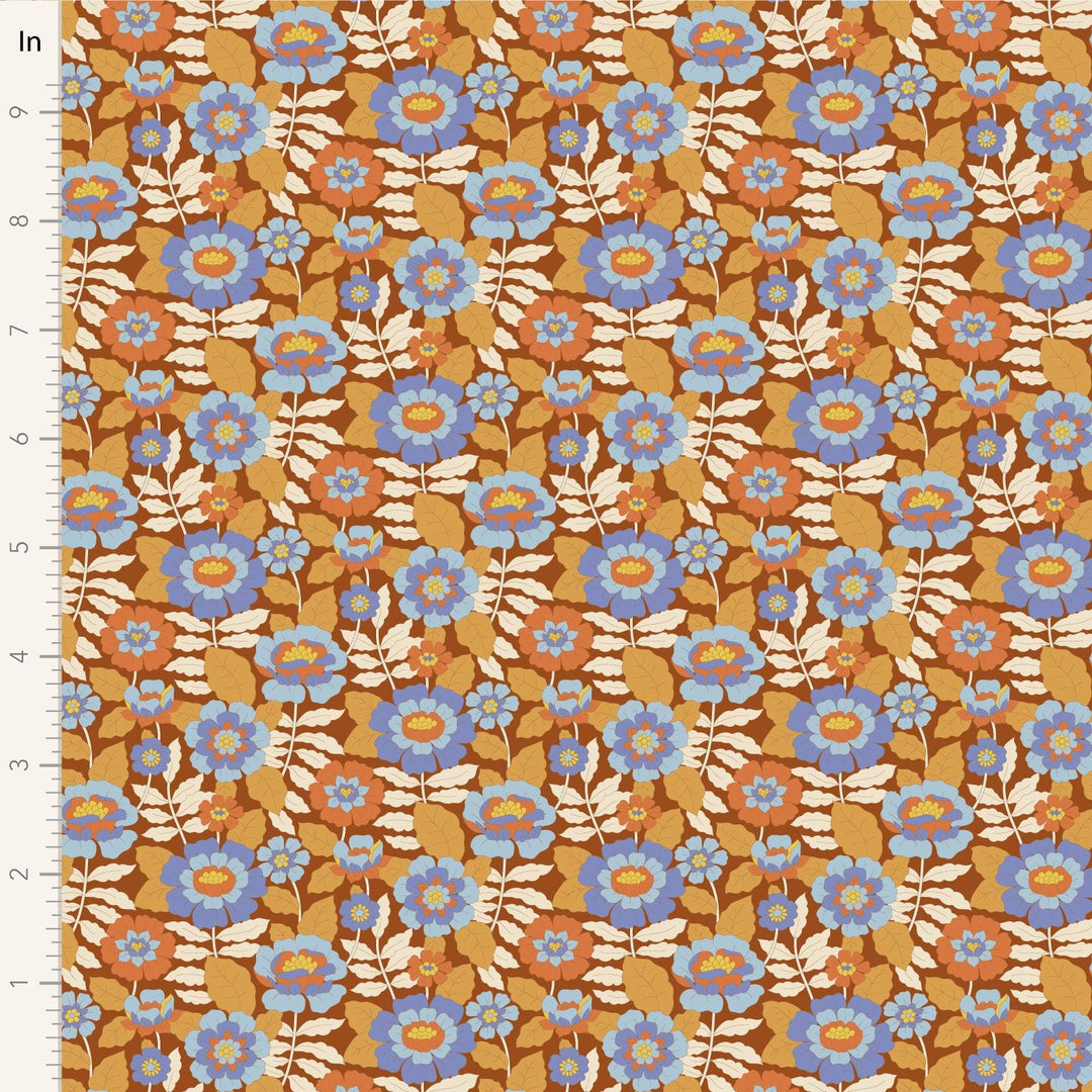 A closeup shot of the quilting fabric pattern called Beverly, designed by Tone Finnanger, in the caramel colorway. The SKU is TIL100612.