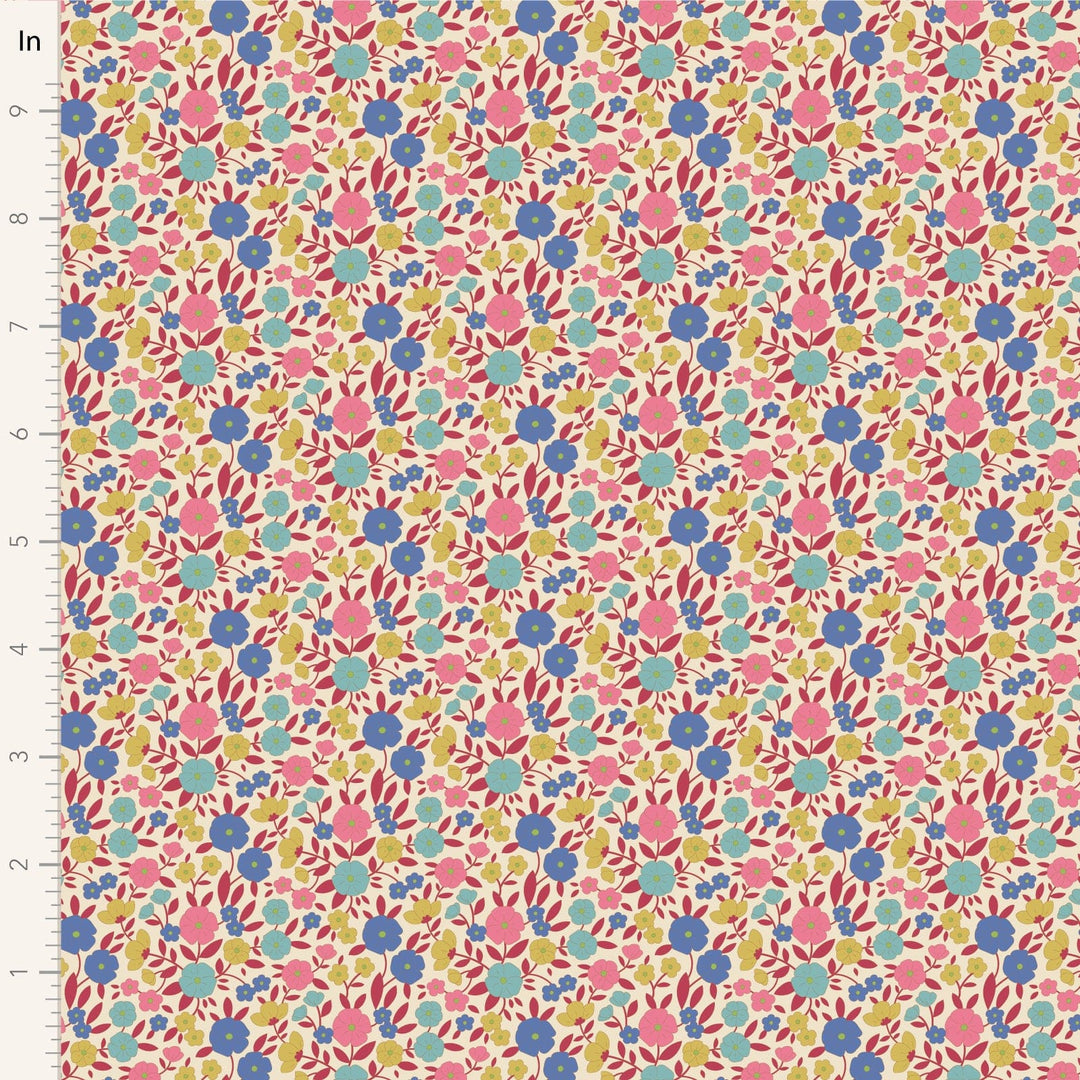 A closeup shot of the quilting fabric pattern called Janice, designed by Tone Finnanger, in the red colorway. The SKU is TIL100614.
