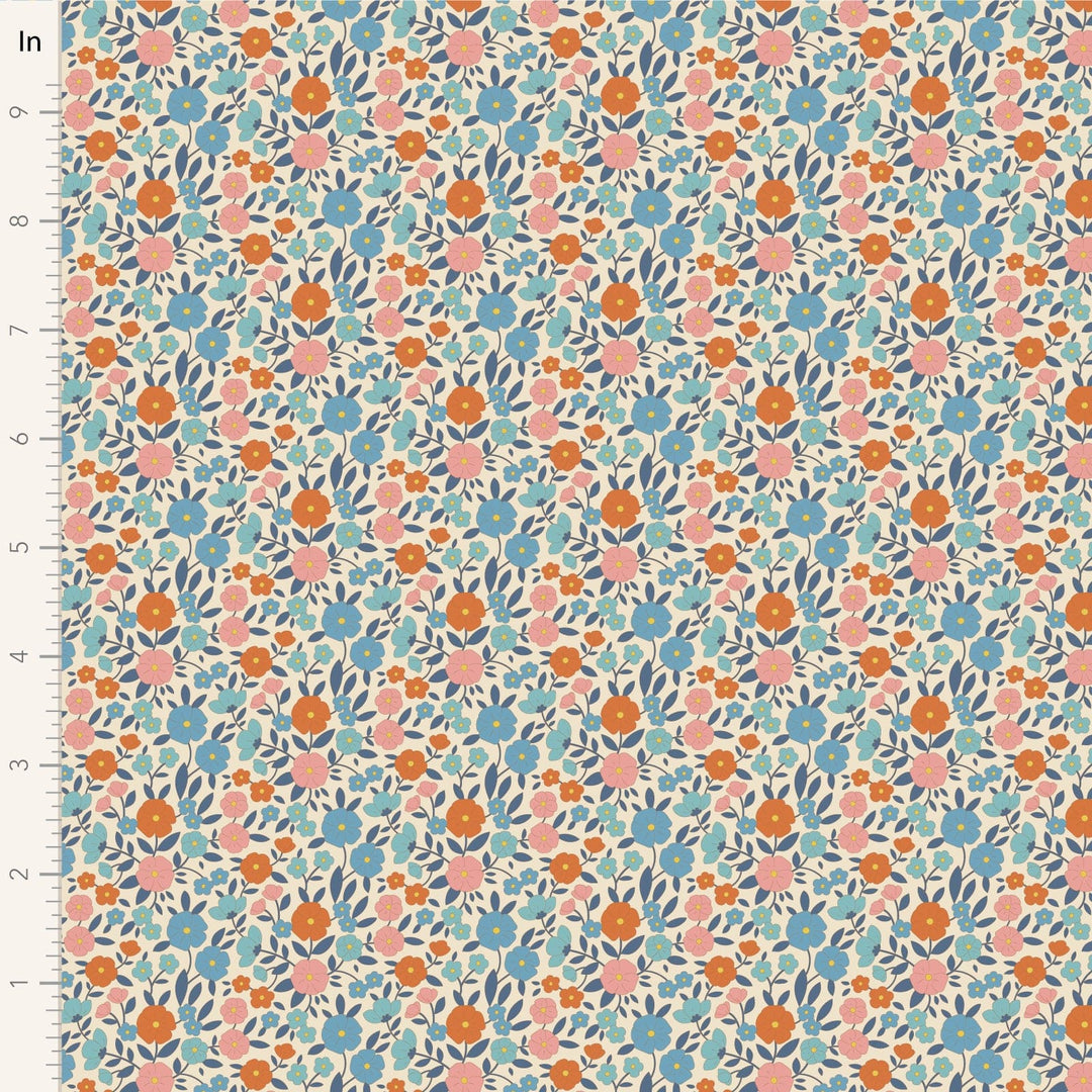 A closeup shot of the quilting fabric pattern called Janice, designed by Tone Finnanger, in the blue colorway. The SKU is TIL100615.