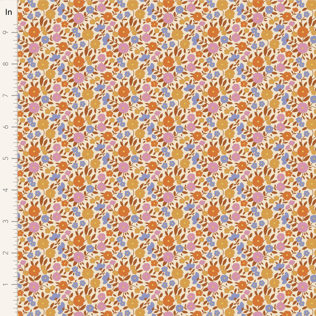 A closeup shot of the quilting fabric pattern called Janice, designed by Tone Finnanger, in the caramel colorway. The SKU is TIL100616.