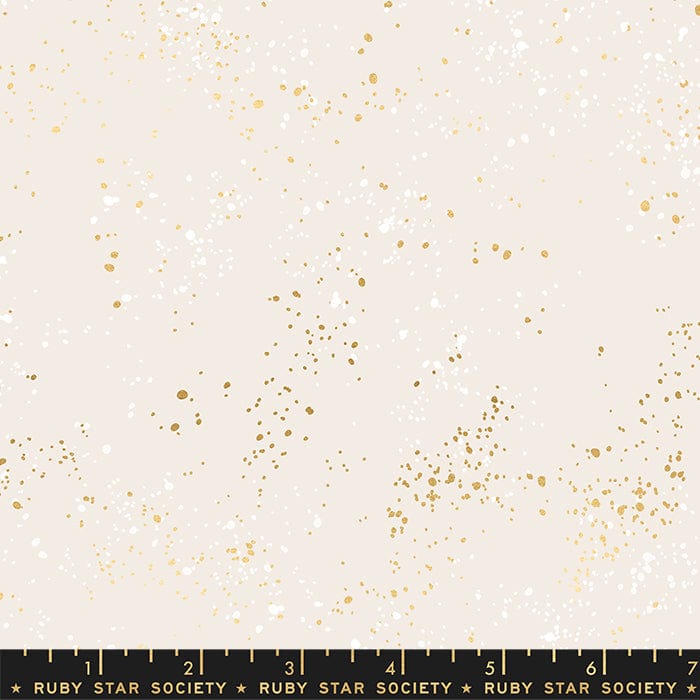 Cotton quilting fabric pattern called '108" Wide Speckled in White Gold'. Part of the 'Speckled Wideback' fabric collection. Designed by Ruby Star Society for fabric company Moda Fabrics. SKU: RS5055 14M. 44-45 inch width.