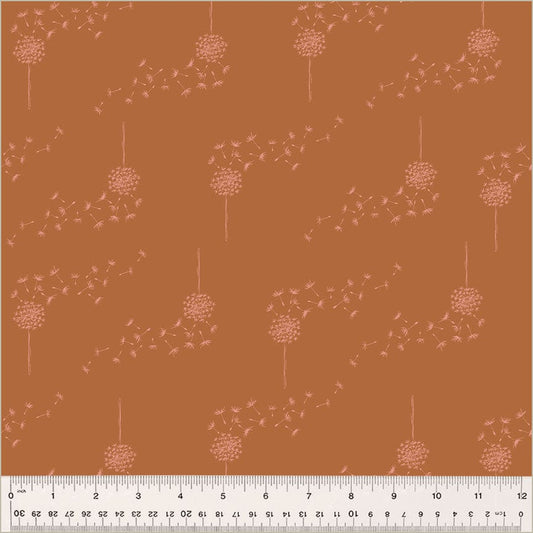 Cotton quilting fabric pattern called 'Wish in Pumpkin'. Part of the 'Moonlit' fabric collection. Designed by Jennifer Moore / Monaluna for fabric company Windham Fabrics. SKU: 54290-5. 44-45 inch width.