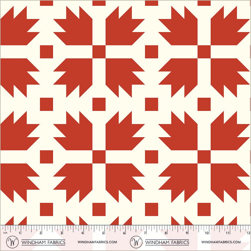 A closeup shot of the quilting fabric pattern called Bear Paw, designed by Whistler Studios, in the red colorway. The SKU is 54879-1.
