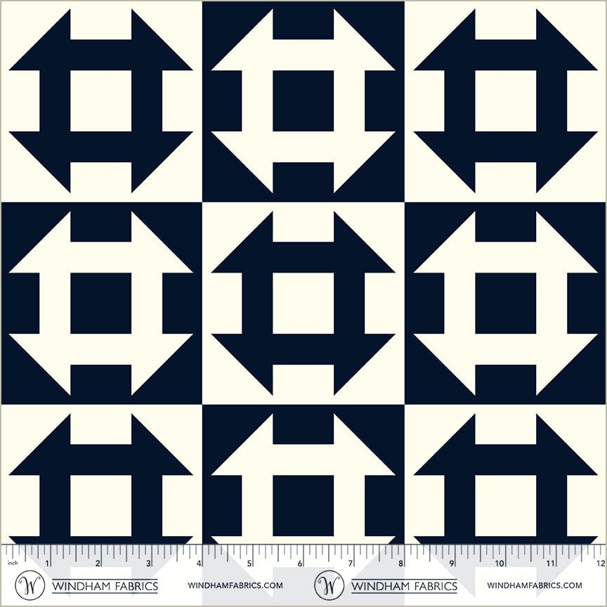 A closeup shot of the quilting fabric pattern called Churn Dash, designed by Whistler Studios, in the navy colorway. The SKU is 54882-2.