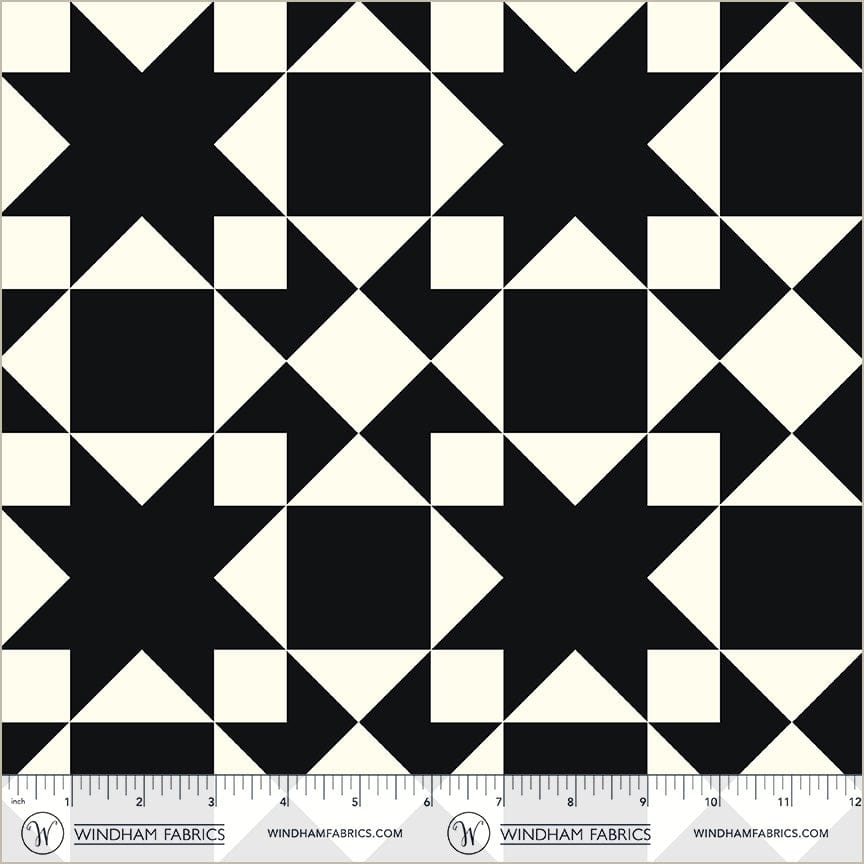 A closeup shot of the quilting fabric pattern called Sawtooth, designed by Whistler Studios, in the black colorway. The SKU is 54883-3.