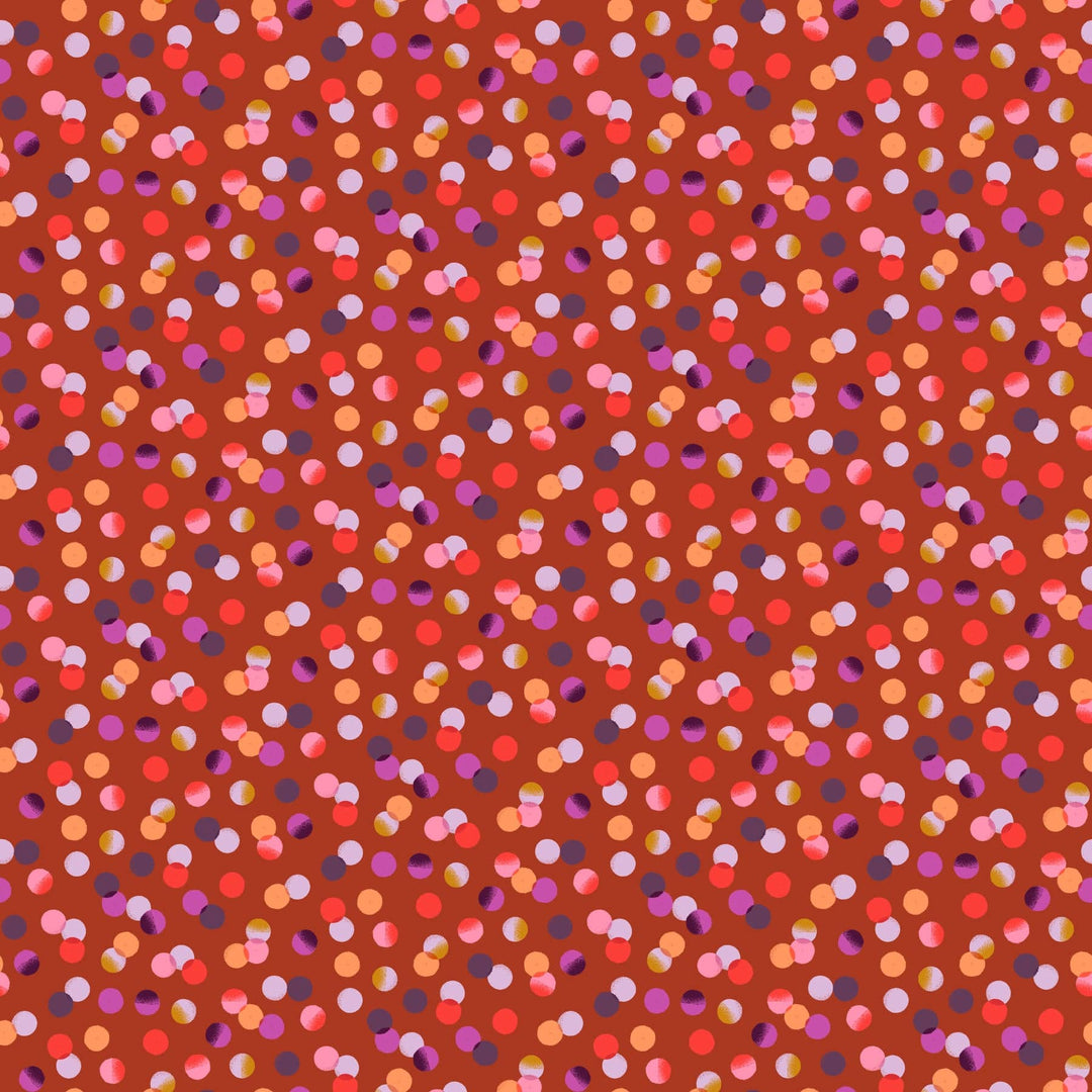 A closeup shot of the quilting fabric pattern called Dots, designed by Josephine Kimberling, in the rust colorway. The SKU is 91061-36.