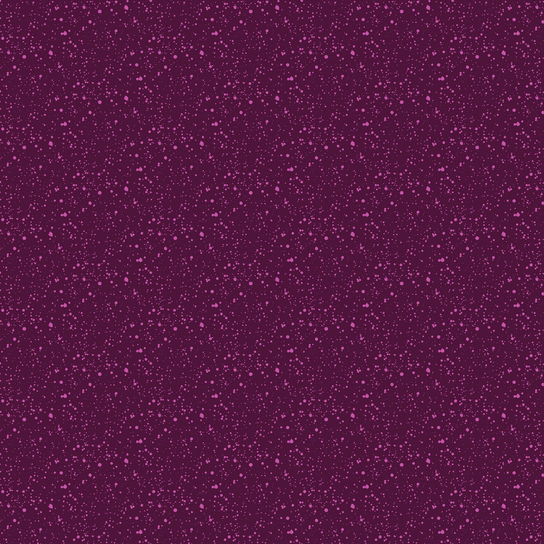 A closeup shot of the quilting fabric pattern called Splatter, designed by Josephine Kimberling, in the plum colorway. The SKU is 91063-84.