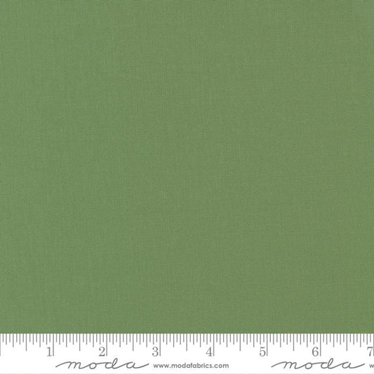 Cotton quilting fabric pattern called 'Prairie Green'. Part of the 'Bella Solids' fabric collection. Designed by Moda Fabrics for fabric company Moda Fabrics. SKU: 9900 102. 44-45 inch width.