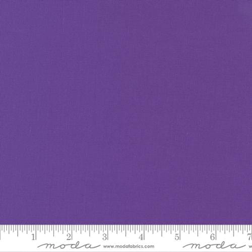 Cotton quilting fabric pattern called 'Vivid Violet'. Part of the 'Bella Solids' fabric collection. Designed by Moda for fabric company Moda. SKU: 9900 413. 44-45 inch width.