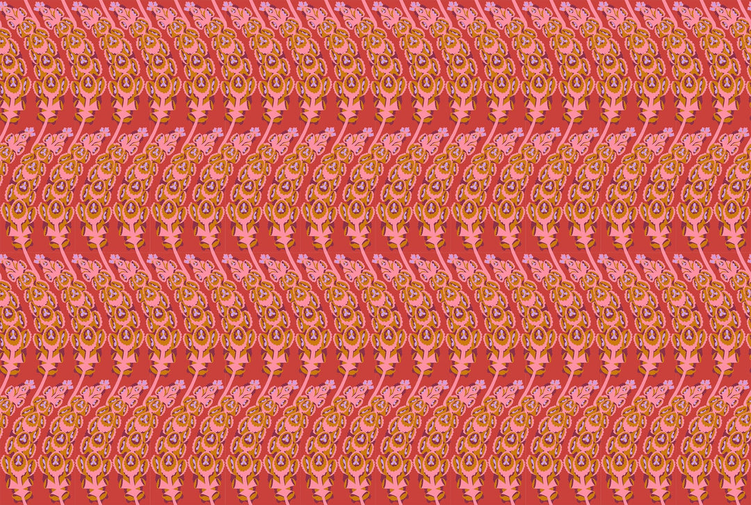 A closeup shot of the quilting fabric pattern called Bells of Ireland, designed by Anna Maria Horner, in the coral colorway. The SKU is AMT133-38V.