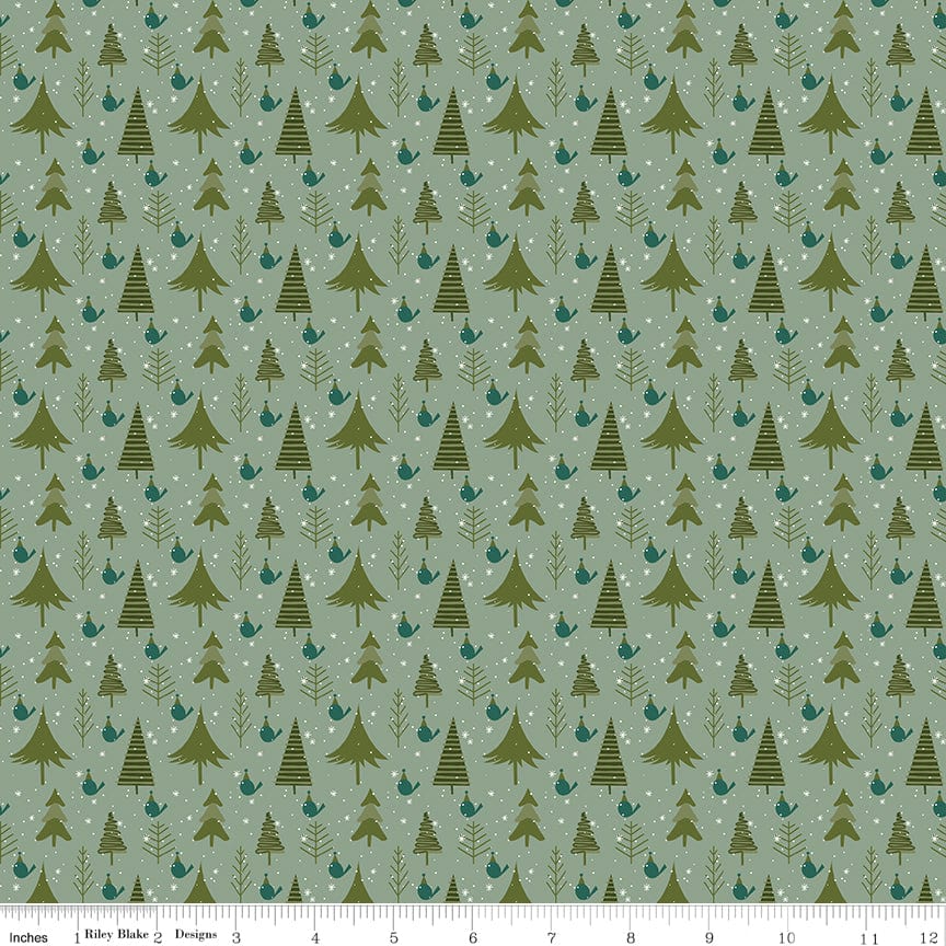 Cotton quilting fabric pattern called 'Trees in Sage'. Part of the 'Christmas is in Town' fabric collection. Designed by Sandy Gervais for fabric company Riley Blake. SKU: C14744-SAGE. 44-45 inch width.