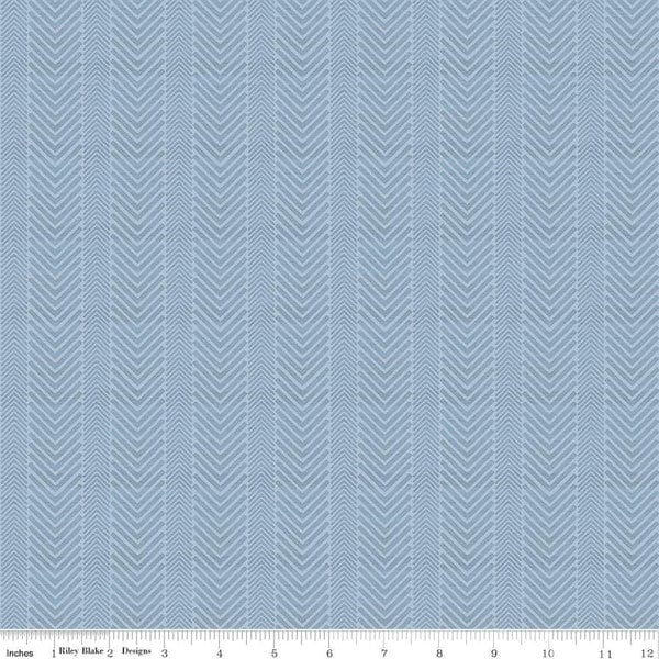 Cotton quilting fabric pattern called 'Herringbone in Sky'. Part of the 'Wake at the Lake' fabric collection. Designed by Tara Reed for fabric company Riley Blake. SKU: C14893-SKY. 44-45 inch width.