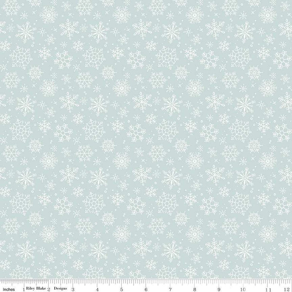 Cotton quilting fabric pattern called 'Snowflake in Blue'. Part of the 'Magical Winterland' fabric collection. Designed by Lisa Audit for fabric company Riley Blake. SKU: C14944-BLUE. 44-45 inch width.
