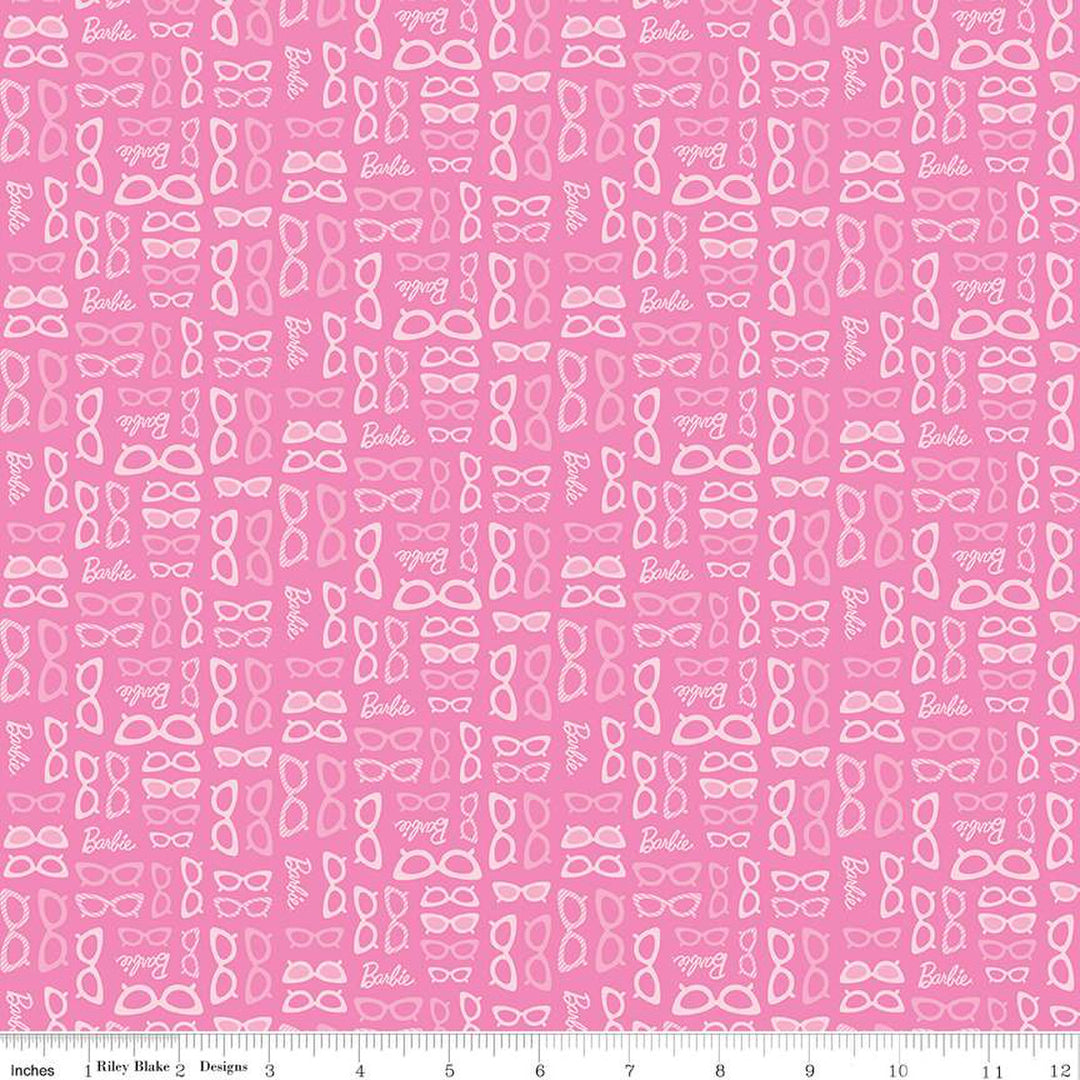Cotton quilting fabric pattern called 'Barbie Glasses Medium Pink'. Part of the 'Barbie World' fabric collection. Designed by Riley Blake Designs for fabric company Riley Blake. SKU: C15025-MEDPINK. 44-45 inch width.