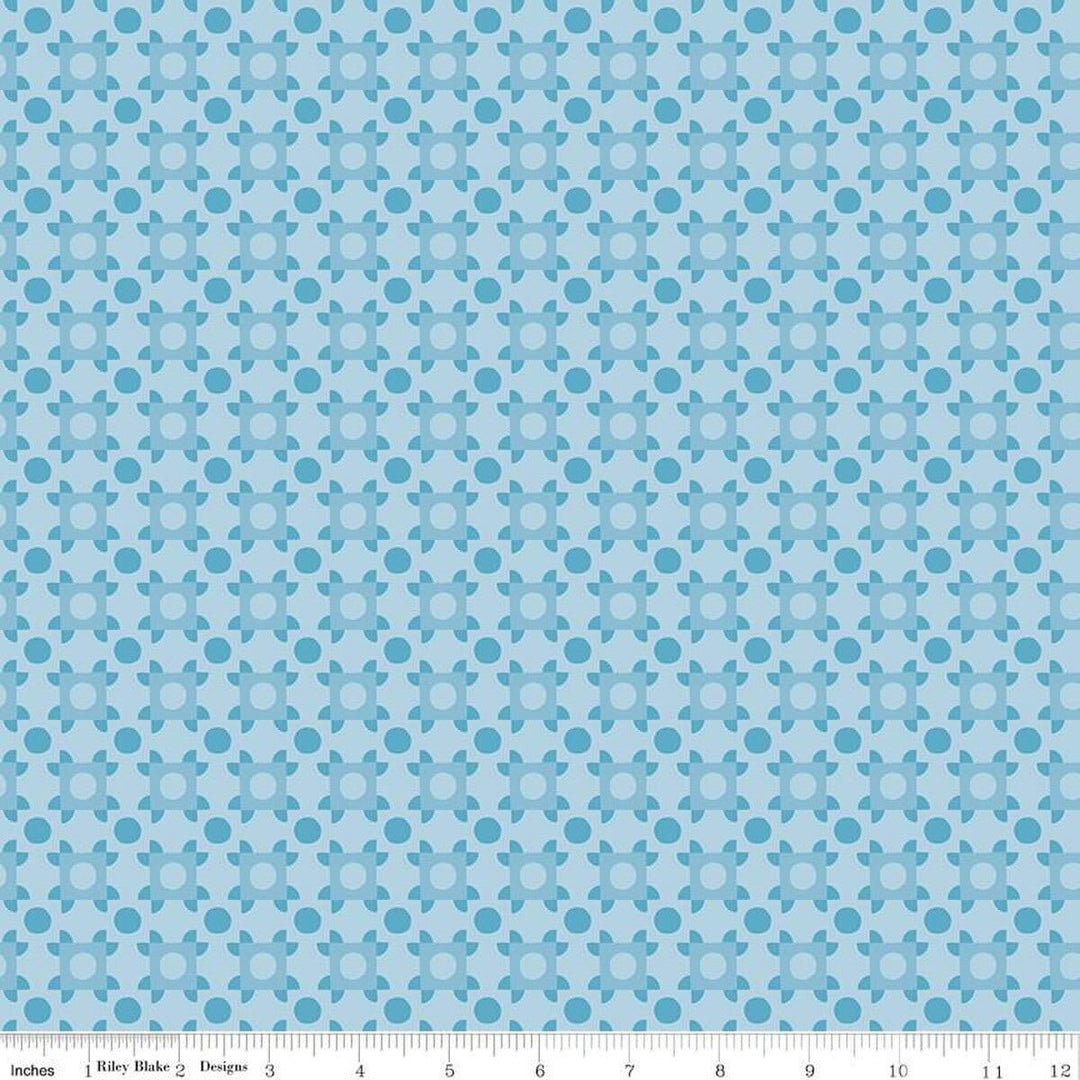 A closeup shot of the quilting fabric pattern called Patchwork Piazza, designed by Genesis Hall, in the blue colorway. The SKU is C16933-BLUE.