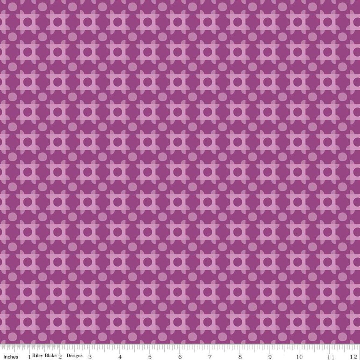 A closeup shot of the quilting fabric pattern called Patchwork Piazza, designed by Genesis Hall, in the grape colorway. The SKU is C16933-GRAPE.