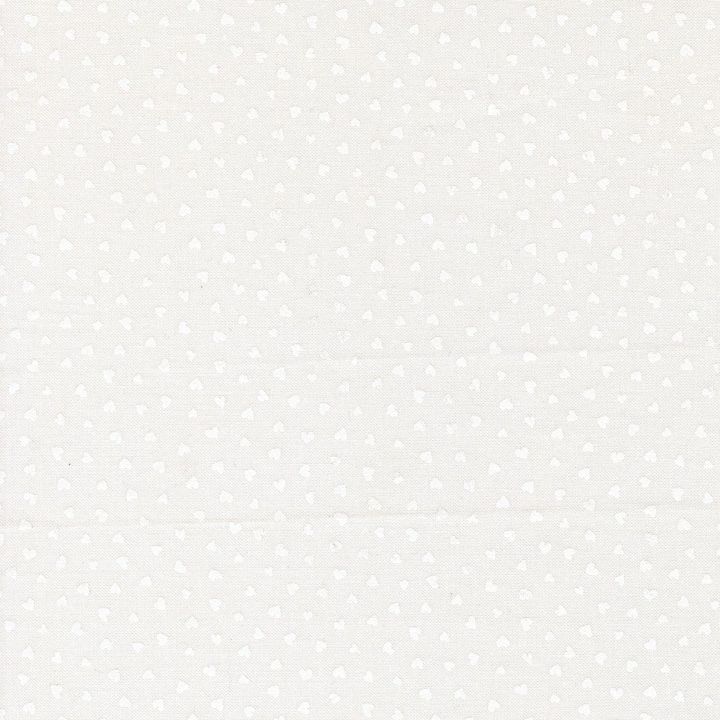 A closeup shot of the quilting fabric pattern called Tiny Hearts, designed by Lizzy House, in the champagne-white colorway. The SKU is 37148 31.