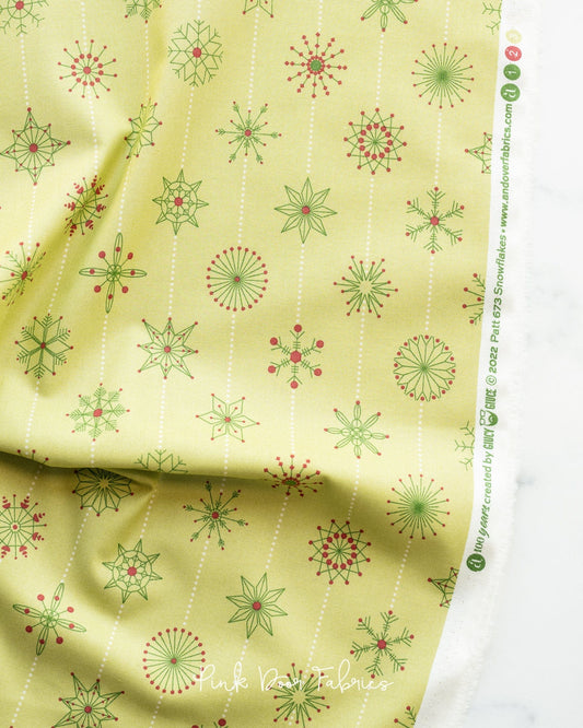 Cotton quilting fabric pattern called 'Snowflakes in Elfo'. Part of the 'Natale' fabric collection. Designed by Giucy Giuce for fabric company Andover Fabrics. SKU: A-673-LG. 44-45 inch width.