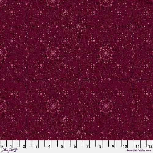 A swatch of 'Flourish in Garnet' fabric from the 'Enrapture' collection by Giucy Giuce for Free Spirit Fabrics, displaying a floral pattern on a garnet red background.
