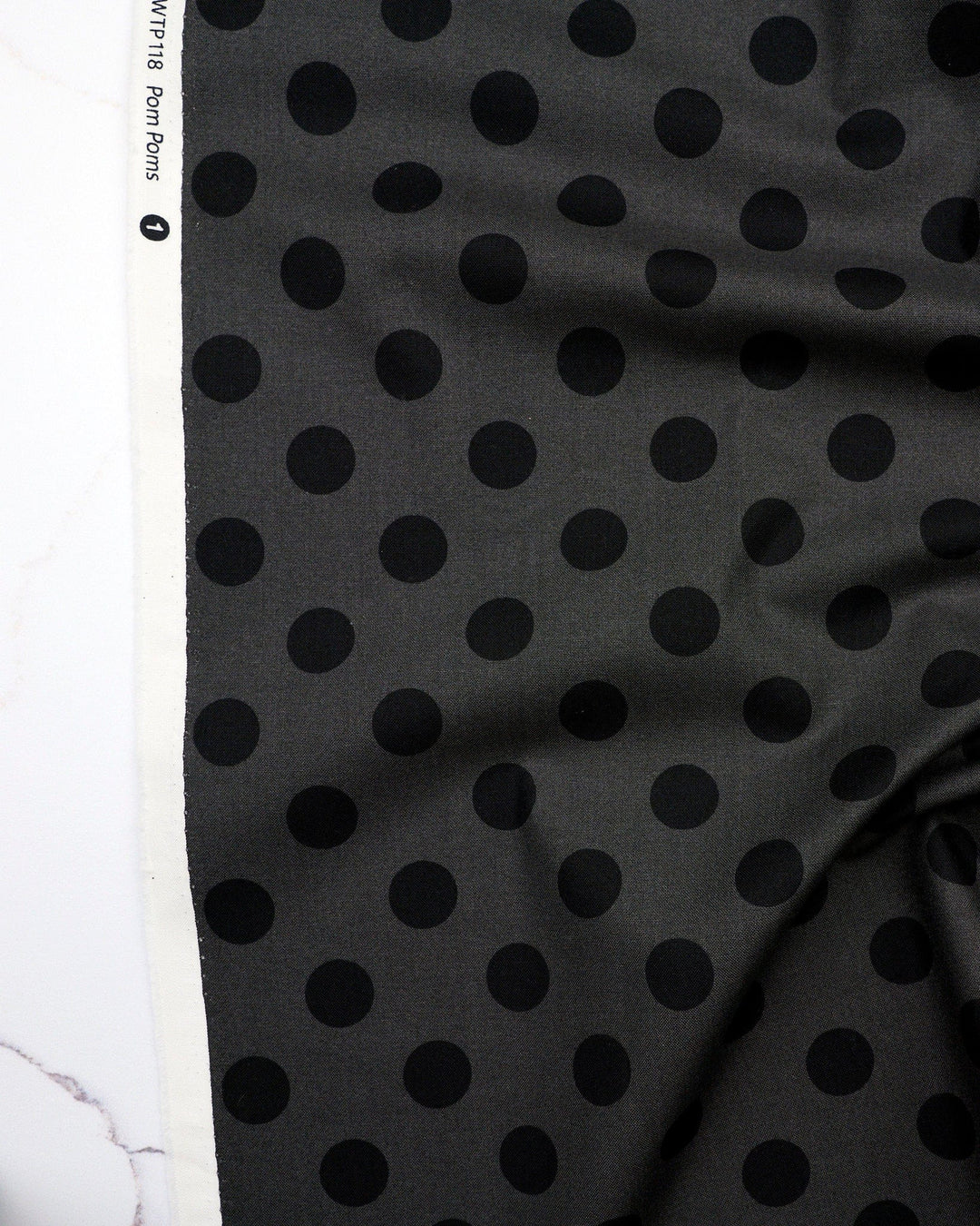 Pom Poms in Carbon quilting fabric, part of the Fall 2025 True Colors fabric collection by Tula Pink (SKU: PWTP118.CARBON)