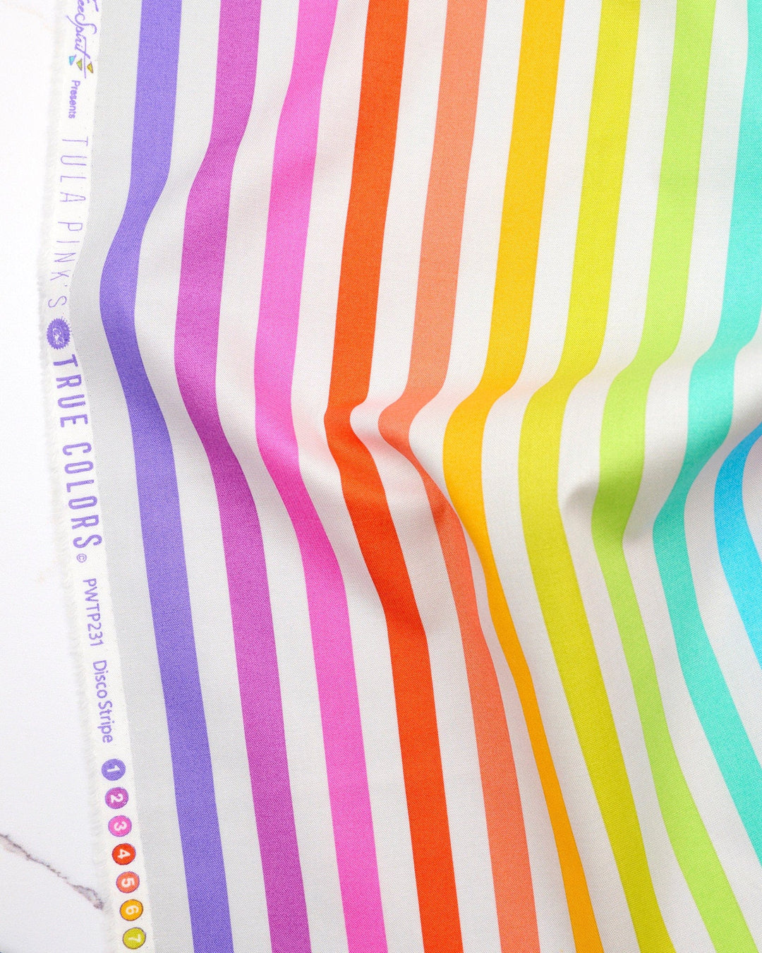Disco Stripe in Whisper quilting fabric, part of the Fall 2025 True Colors fabric collection by Tula Pink (SKU: PWTP231.WHISPER)