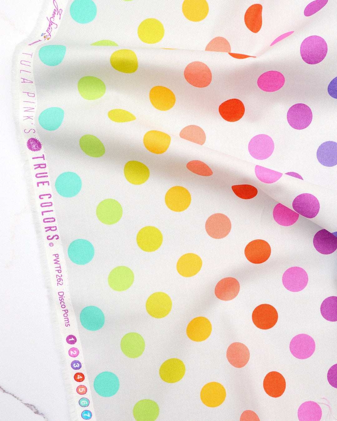 Disco Poms in Whisper quilting fabric, part of the Fall 2025 True Colors fabric collection by Tula Pink (SKU: PWTP262.WHISPER)