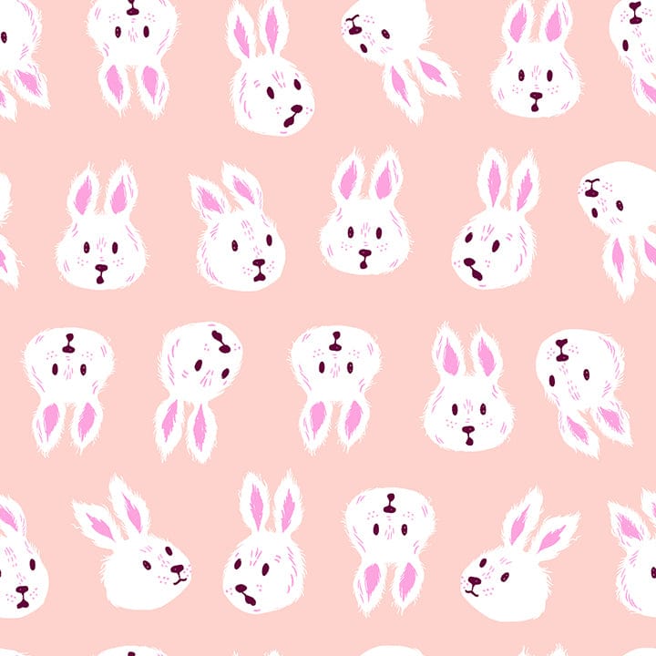 A closeup shot of the quilting fabric pattern called Rushing Rabbit, designed by Sarah Watts for Ruby Star Society, in the vintage pink colorway. The SKU is RS2125 11.