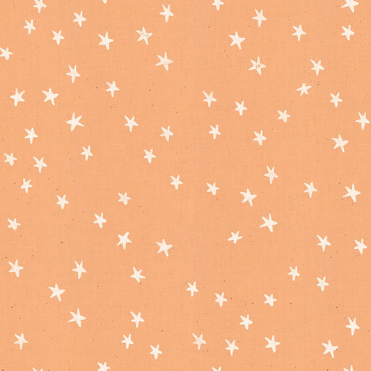 Cotton quilting fabric pattern called 'Starry in Warm Peach'. Part of the 'Starry' fabric collection. Designed by Alexia Abegg for fabric company Moda Fabrics. SKU: RS4006 17. 44-45 inch width.
