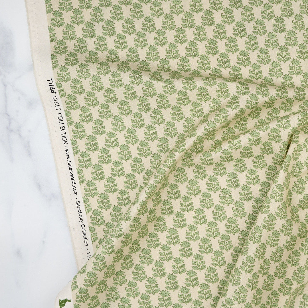 Cotton quilting fabric pattern called 'Mira Sage'. Part of the 'Sanctuary' fabric collection. Designed by Tone Finnanger for fabric company Tilda Fabrics. SKU: TIL110112. 44-45 inch width.