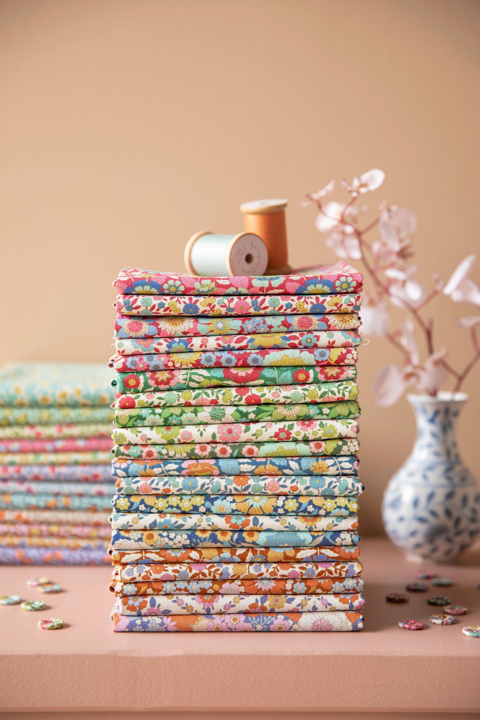 A stack of quilting fabrics from the Wallflower Fabric Collection by Tilda Fabrics (Tone Finnanger)
