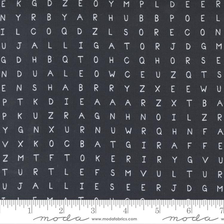 Cotton quilting fabric pattern called 'Word Search in Black'. Part of the 'ABC...xyz' fabric collection. Designed by Stacey Iest Hsu for fabric company Moda Fabrics. SKU: 20818 20. 44-45 inch width.