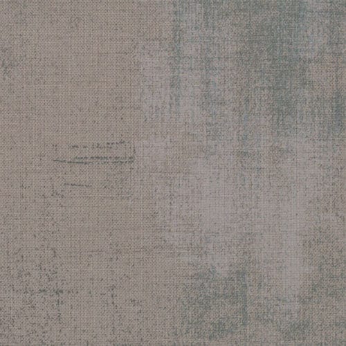 Cotton quilting fabric pattern called 'Grunge in Grey Couture'. Part of the 'Grunge Basics' fabric collection. Designed by Basic Grey for fabric company Moda Fabrics. SKU: 30150 163. 44-45 inch width.