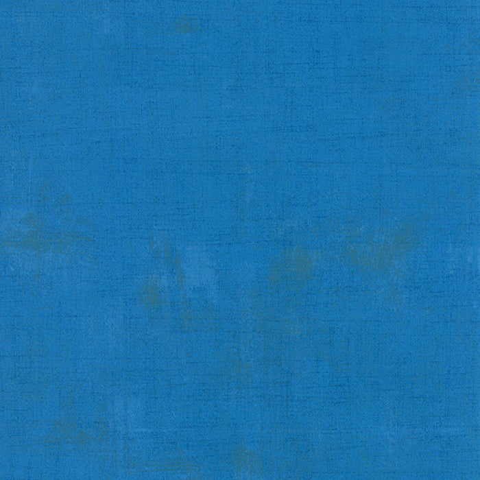 Cotton quilting fabric pattern called 'Grunge in Sapphire'. Part of the 'Grunge Basics' fabric collection. Designed by Basic Grey for fabric company Moda Fabrics. SKU: 30150 221. 44-45 inch width.
