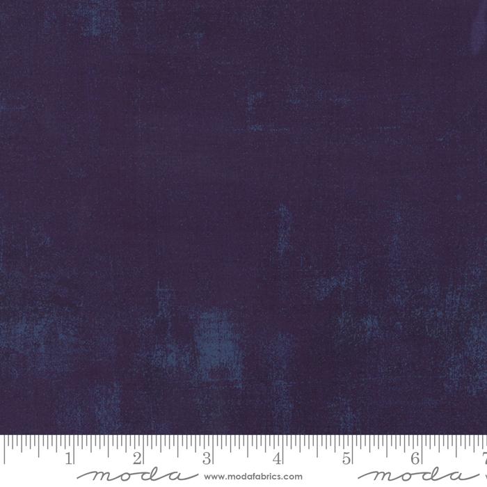 Cotton quilting fabric pattern called 'Grunge in Eggplant'. Part of the 'Grunge Basics' fabric collection. Designed by Basic Grey for fabric company Moda Fabrics. SKU: 30150 245. 44-45 inch width.