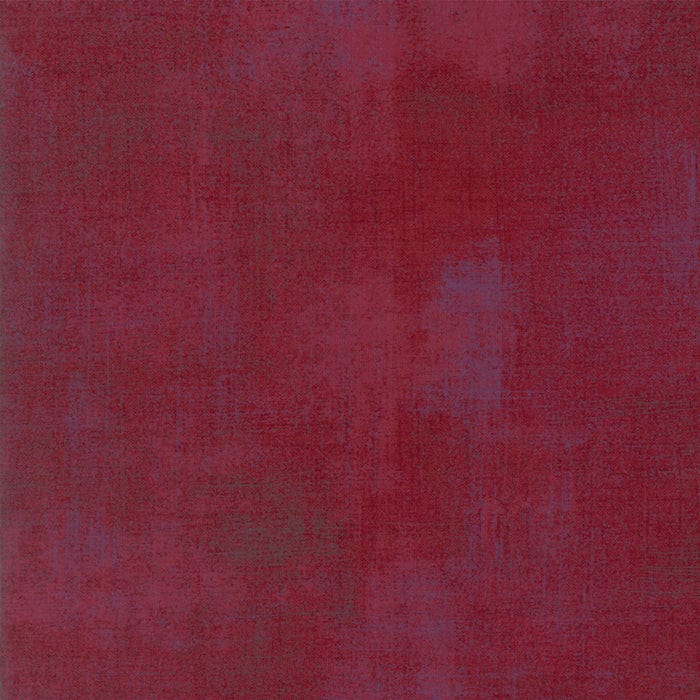 Cotton quilting fabric pattern called 'Grunge in Beet Red'. Part of the 'Grunge Basics' fabric collection. Designed by Basic Grey for fabric company Moda Fabrics. SKU: 30150-334. 44-45 inch width.