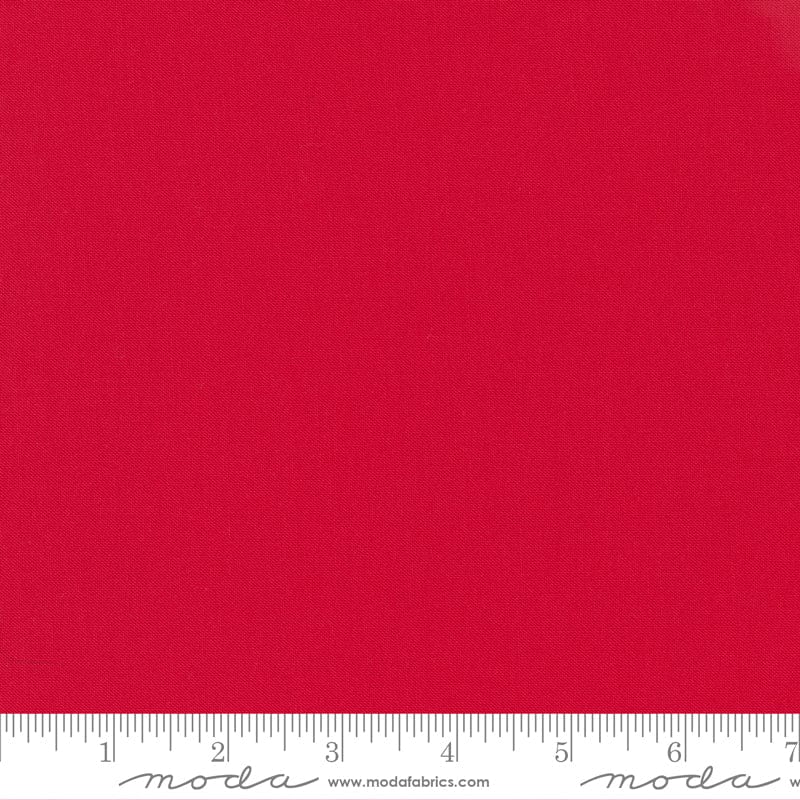 Cotton quilting fabric pattern called 'Betty's Red'. Part of the 'Bella Solids' fabric collection. Designed by Moda Fabrics for fabric company Moda Fabrics. SKU: 9900 123. 44-45 inch width.