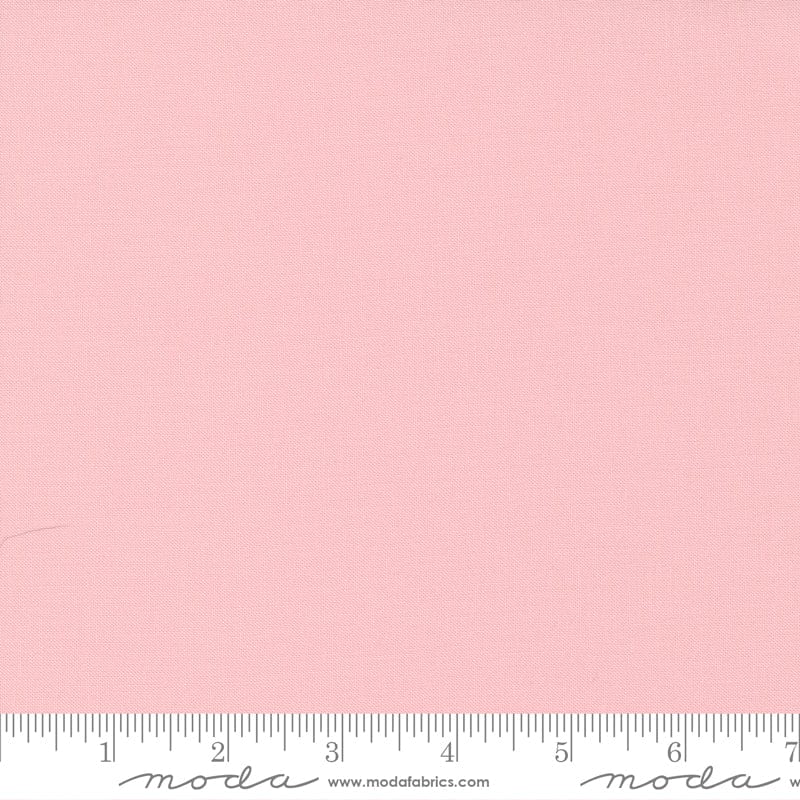 Cotton quilting fabric pattern called 'Sister's Pink'. Part of the 'Bella Solids' fabric collection. Designed by Moda Fabrics for fabric company Moda Fabrics. SKU: 9900 145. 44-45 inch width.