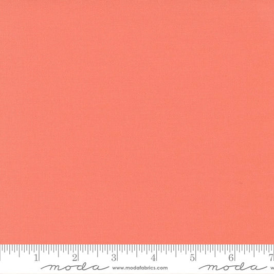 Cotton quilting fabric pattern called 'Coral'. Part of the 'Bella Solids' fabric collection. Designed by Moda Fabrics for fabric company Moda Fabrics. SKU: 9900 147. 44-45 inch width.