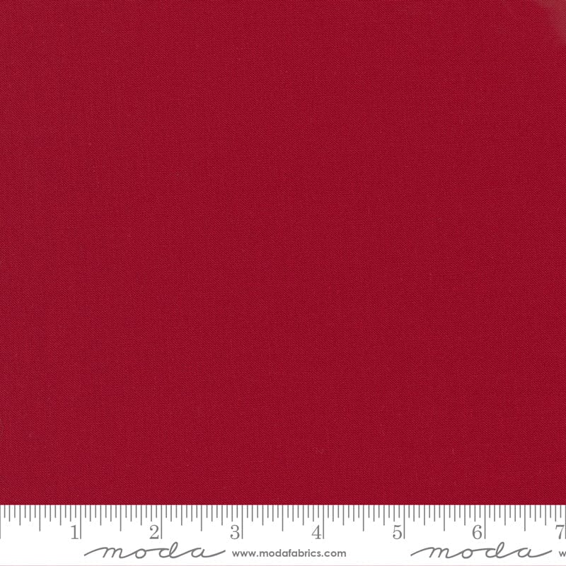 Cotton quilting fabric pattern called 'Country Red'. Part of the 'Bella Solids' fabric collection. Designed by Moda Fabrics for fabric company Moda Fabrics. SKU: 9900 17. 44-45 inch width.