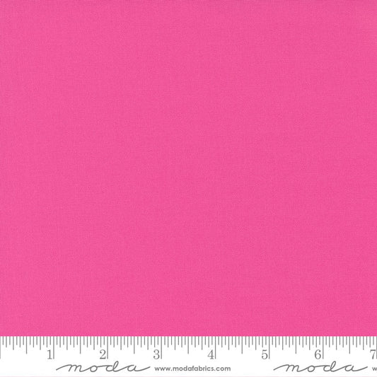 Cotton quilting fabric pattern called 'Fuchsia'. Part of the 'Bella Solids' fabric collection. Designed by Moda Fabrics for fabric company Moda Fabrics. SKU: 9900 190. 44-45 inch width.