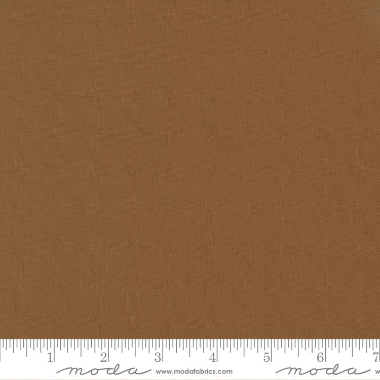 Cotton quilting fabric pattern called 'Solid in Sienna'. Part of the 'Christmas Eve' fabric collection. Designed by Lella Boutique for fabric company Moda Fabrics. SKU: 9900 194. 44-45 inch width.