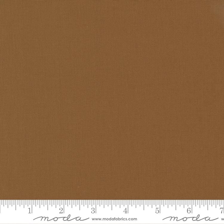 Cotton quilting fabric pattern called 'Solid in Sienna'. Part of the 'Christmas Eve' fabric collection. Designed by Lella Boutique for fabric company Moda Fabrics. SKU: 9900 194. 44-45 inch width.