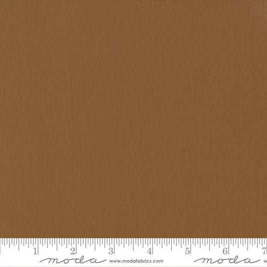 Cotton quilting fabric pattern called 'Solid in Sienna'. Part of the 'Christmas Eve' fabric collection. Designed by Lella Boutique for fabric company Moda Fabrics. SKU: 9900 194. 44-45 inch width.