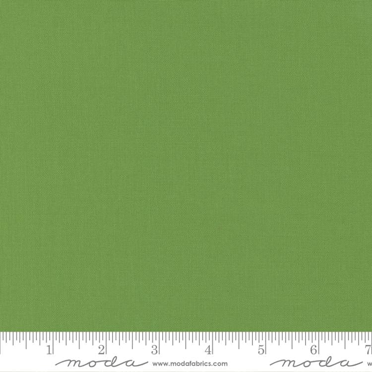 Cotton quilting fabric pattern called 'Fresh Grass'. Part of the 'Bella Solids' fabric collection. Designed by Moda Fabrics for fabric company Moda Fabrics. SKU: 9900 228. 44-45 inch width.