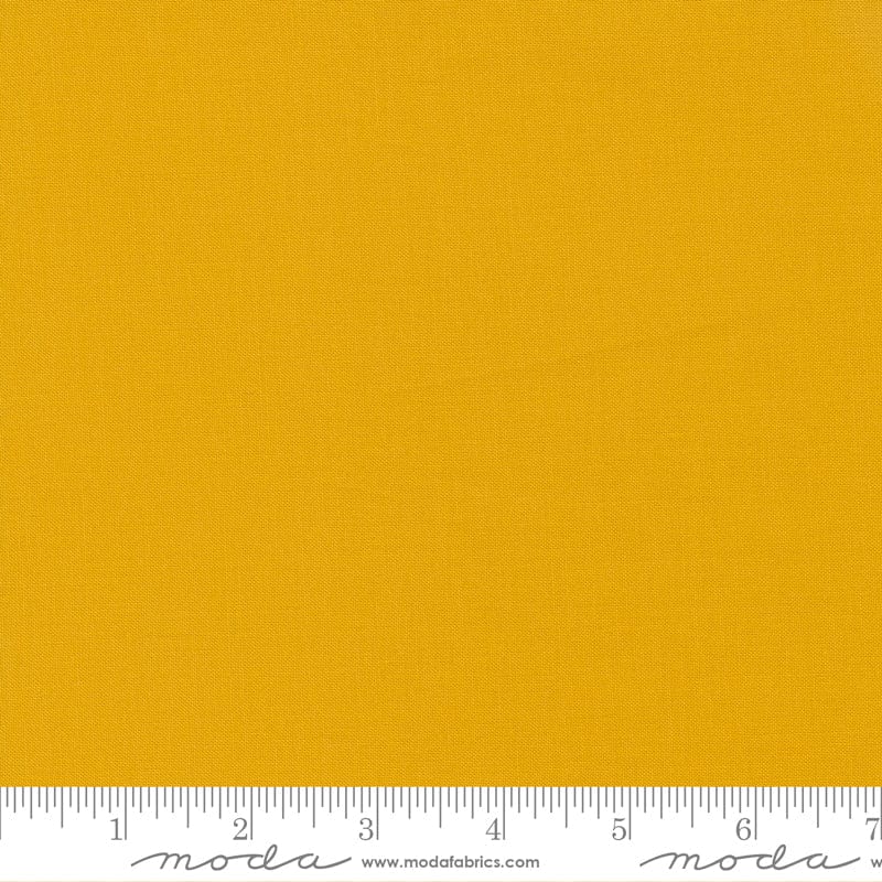 Cotton quilting fabric pattern called 'Saffron'. Part of the 'Bella Solids' fabric collection. Designed by Moda Fabrics for fabric company Moda Fabrics. SKU: 9900 232. 44-45 inch width.