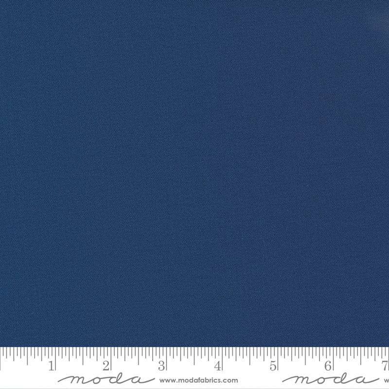 Cotton quilting fabric pattern called 'Nautical Blue'. Part of the 'Bella Solids' fabric collection. Designed by Moda Fabrics for fabric company Moda Fabrics. SKU: 9900 236. 44-45 inch width.