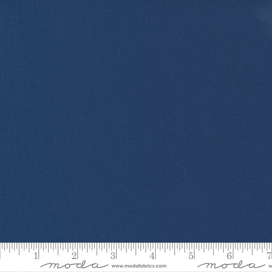 Cotton quilting fabric pattern called 'Nautical Blue'. Part of the 'Bella Solids' fabric collection. Designed by Moda Fabrics for fabric company Moda Fabrics. SKU: 9900 236. 44-45 inch width.