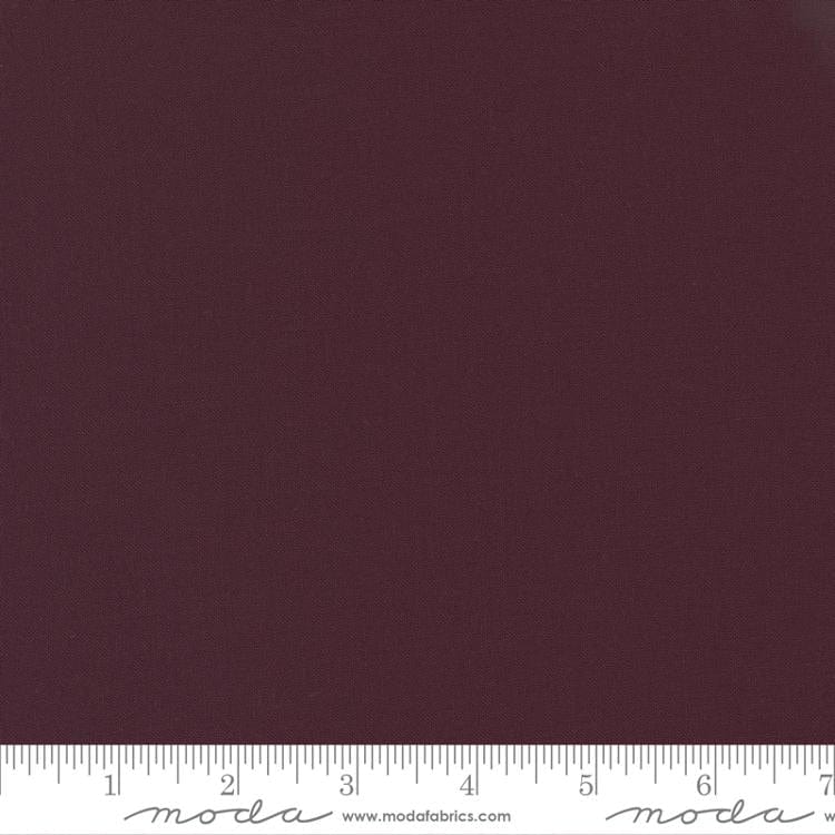 Cotton quilting fabric pattern called 'Merlot'. Part of the 'Bella Solids' fabric collection. Designed by Moda Fabrics for fabric company Moda Fabrics. SKU: 9900 279. 44-45 inch width.
