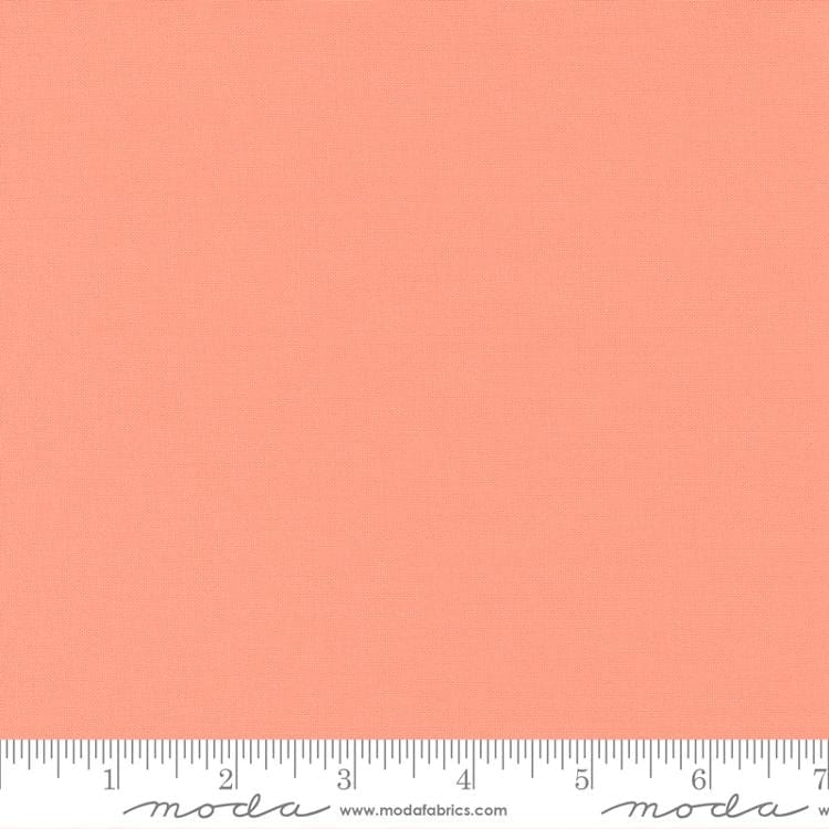 Cotton quilting fabric pattern called 'Peach Blossom'. Part of the 'Bella Solids' fabric collection. Designed by Moda Fabrics for fabric company Moda Fabrics. SKU: 9900 297. 44-45 inch width.
